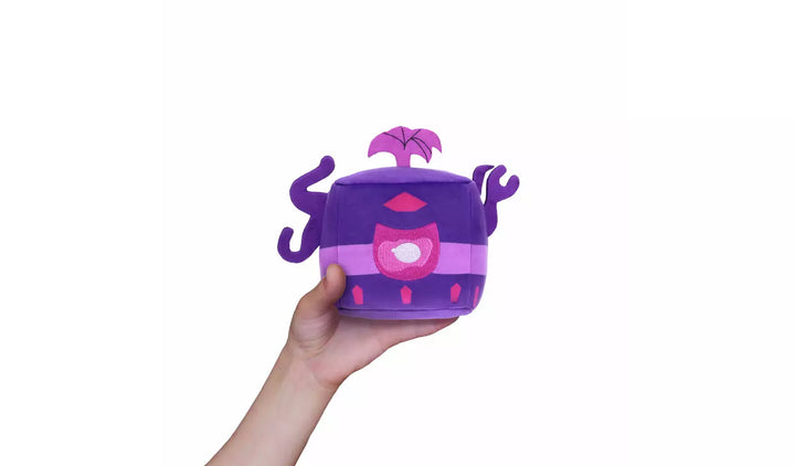 Blox Fruits Series 3 4-inch Collectable Plush in hand, featuring a colorful design with purple and pink details.
