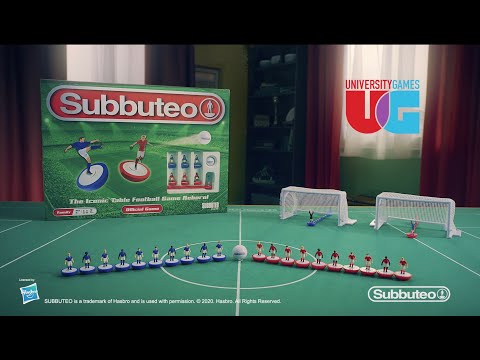 Subbuteo Fences set including players, goals, and game box on a table for tabletop football experience.